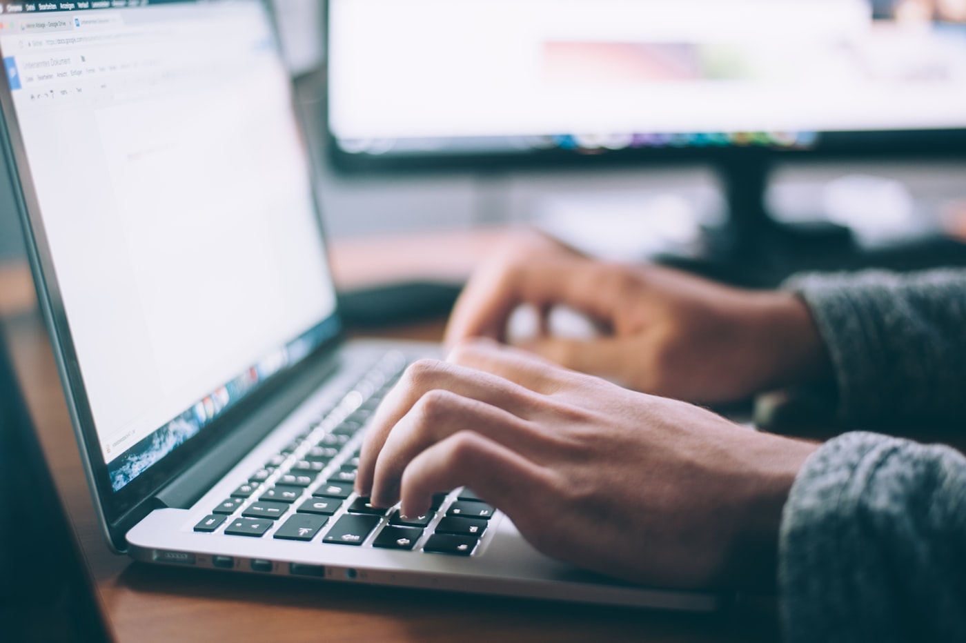 Person writing an email enquiry about addiction treatment admission
