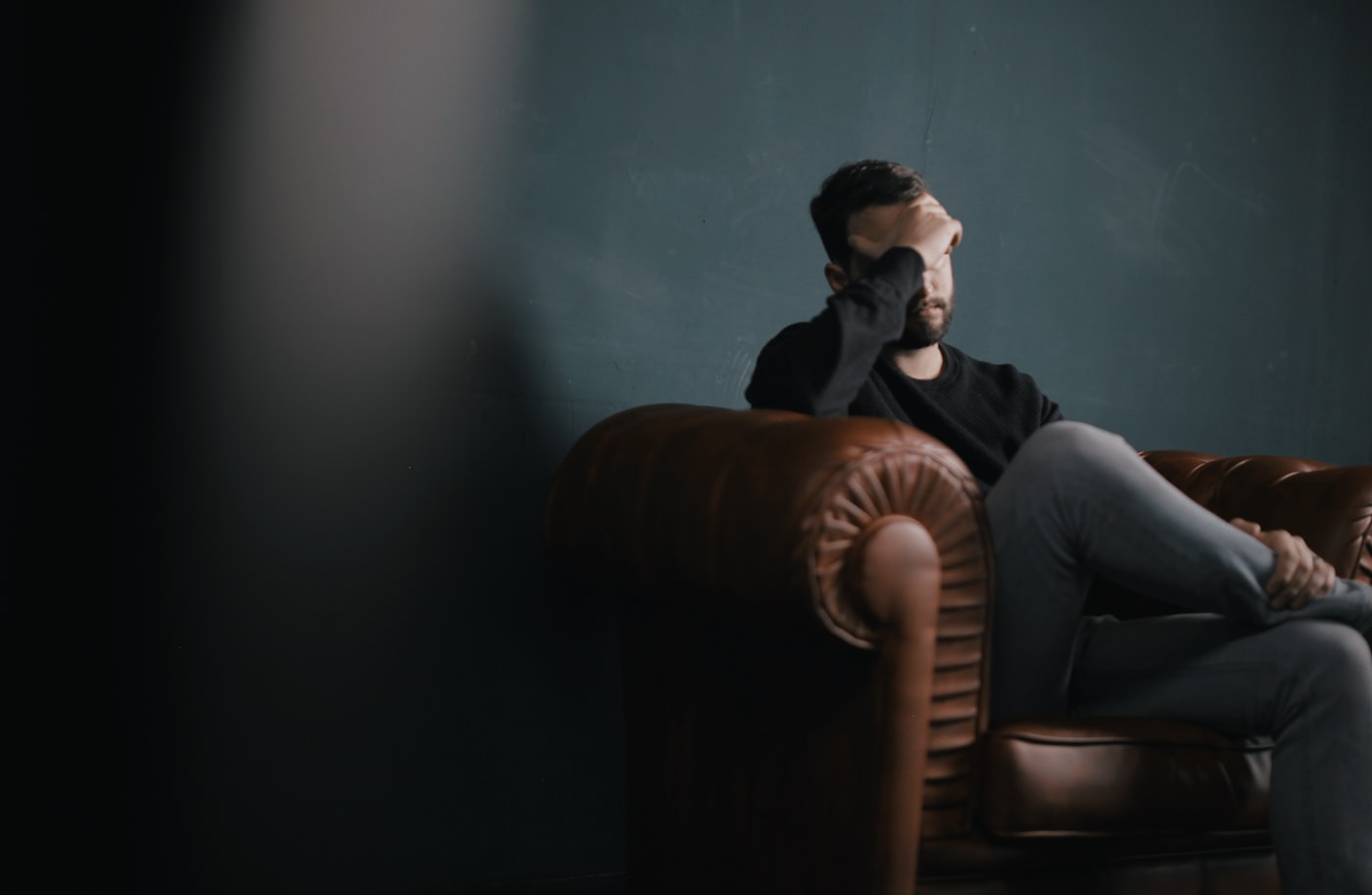 Young adult experiencing anxiety and paranoia from amphetamine misuse