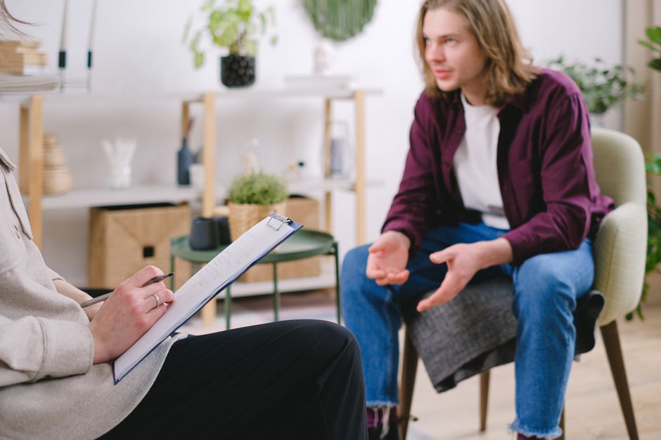 Counselor welcoming a client to an addiction treatment center office