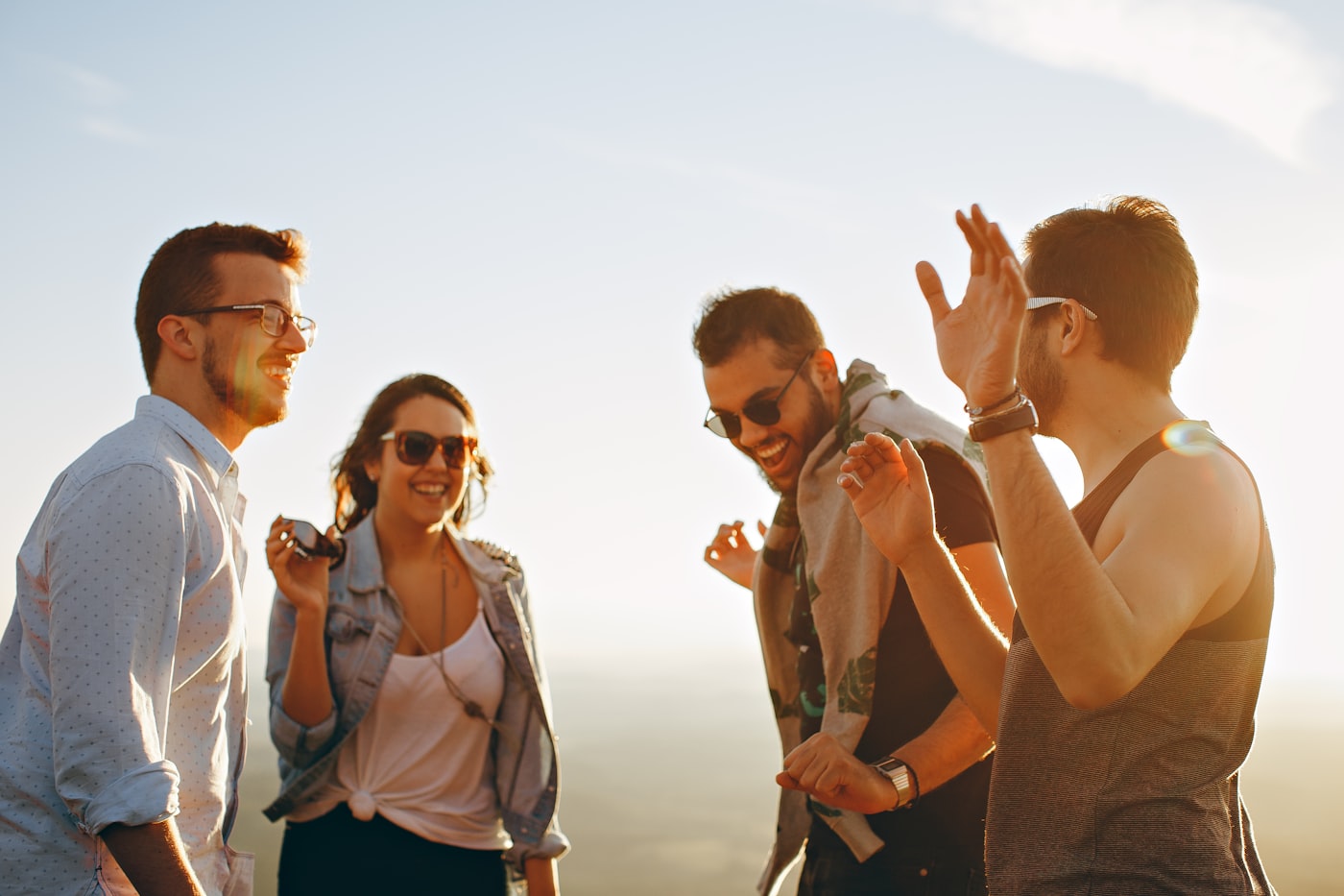 Group of friends choosing a sober designated driver before leaving a party