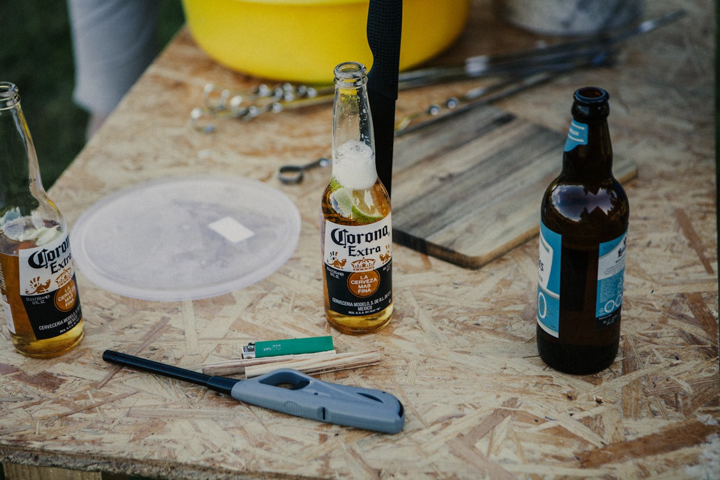 Empty beer bottles on a table next to a set of car keys