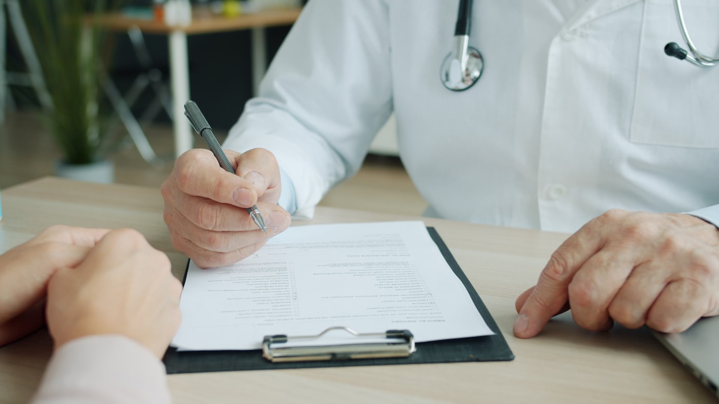 Doctor speaking with a patient during a GP consultation about detox