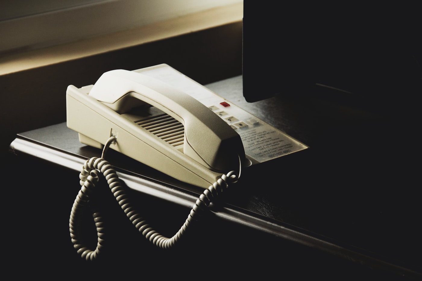 Person using a telephone helpline for confidential addiction advice