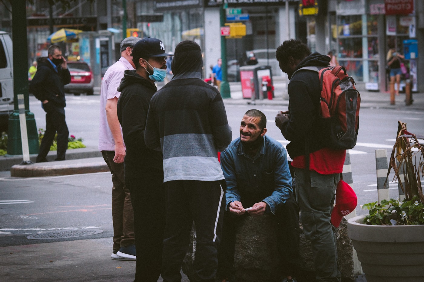 Outreach worker talking with someone on a city street