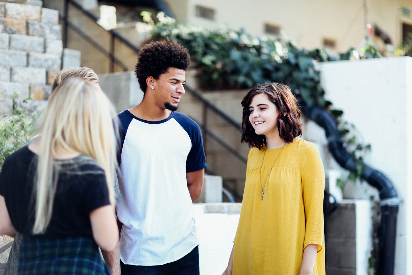 Young adult in a supportive conversation with a youth worker