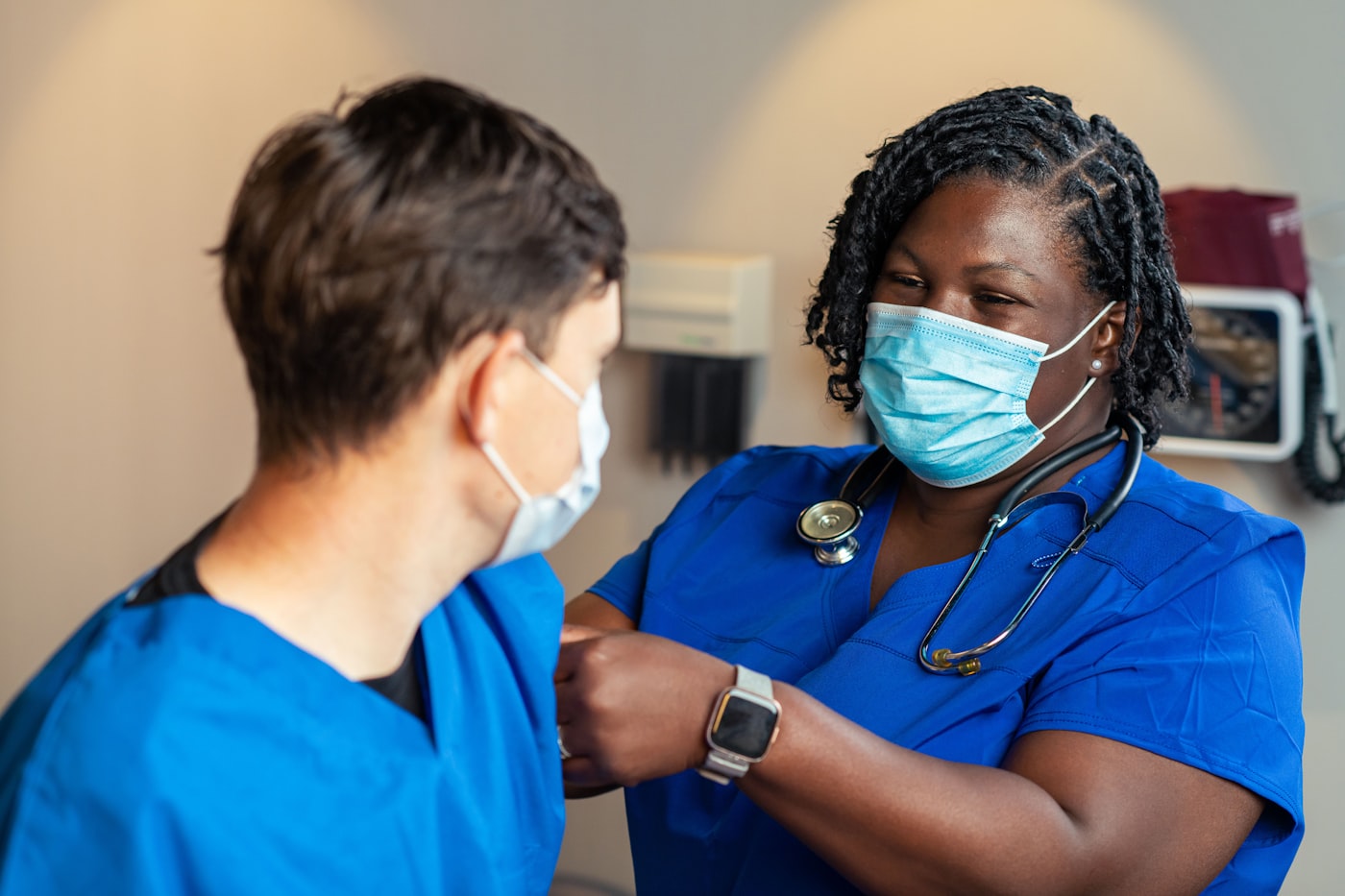 Compassionate healthcare worker gently reassuring a patient in a bright clinic