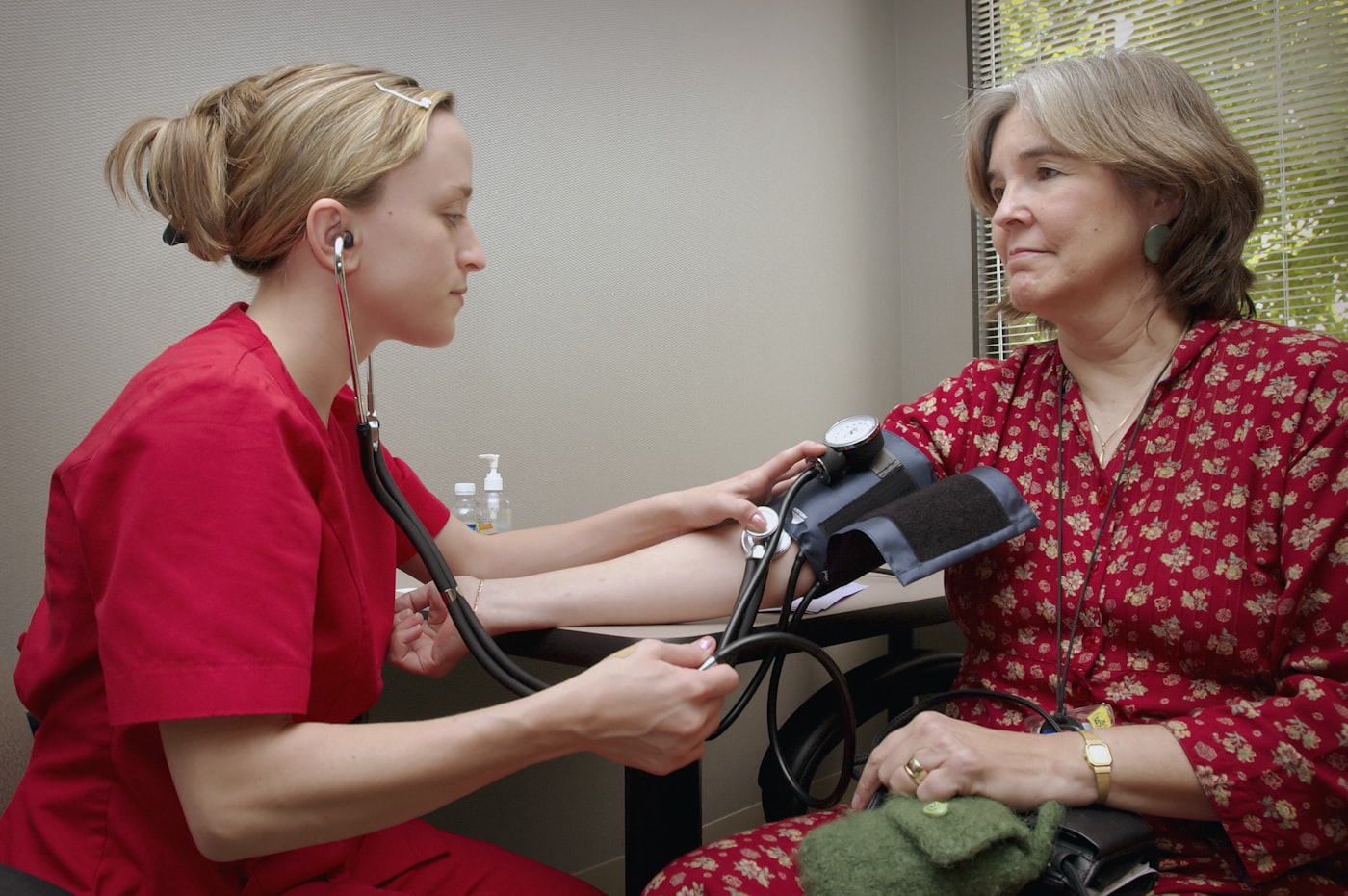 Nurse checking a patient's blood pressure during medically supervised detox