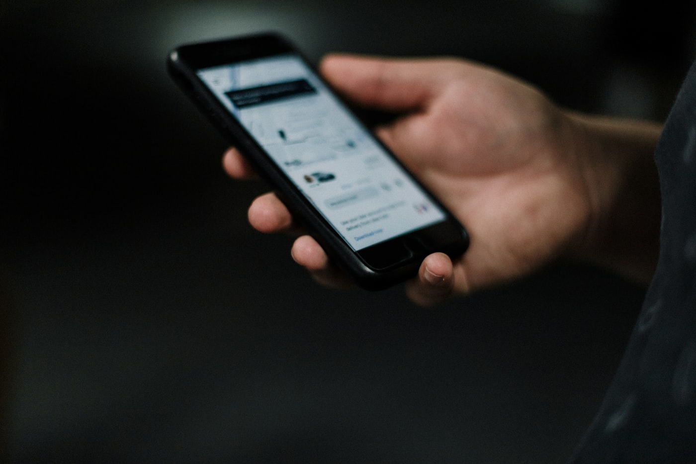 Smartphone showing a rideshare app as a safe alternative to driving impaired
