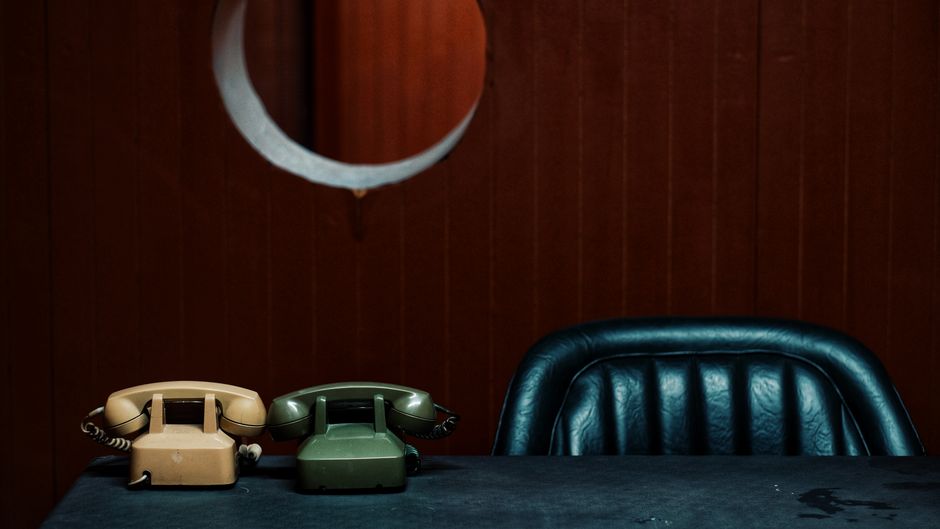 Two telephones side by side representing two separate service numbers